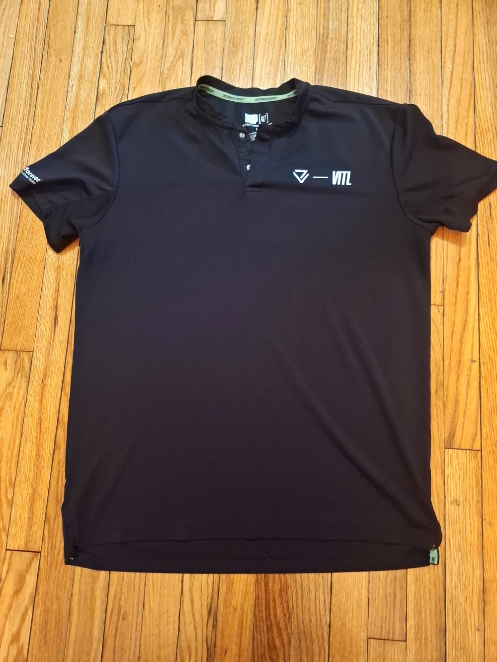 Uncommon Black Short-Sleeve Henley Polo with Subtle Logo